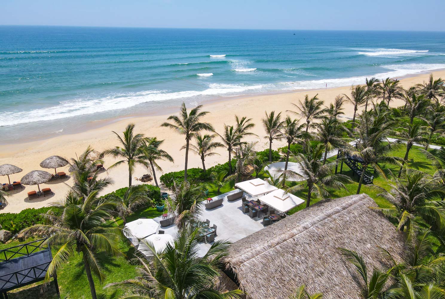 Cham Beach Bar sits right on the shore, offering panoramic views of Cù Lao Chàm (Cham Islands) in the distance